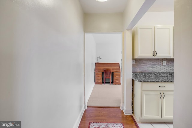 hallway with light wood-type flooring