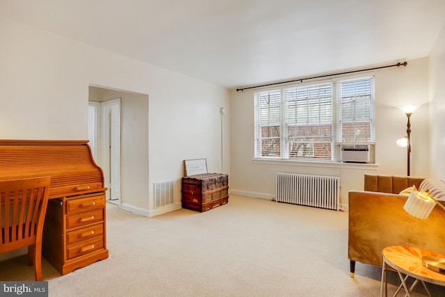 living area featuring light colored carpet, radiator, and cooling unit