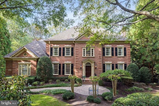 colonial-style house with a patio