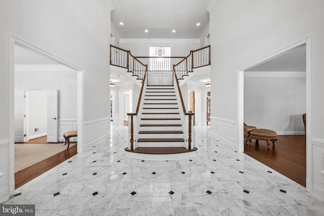 staircase featuring crown molding