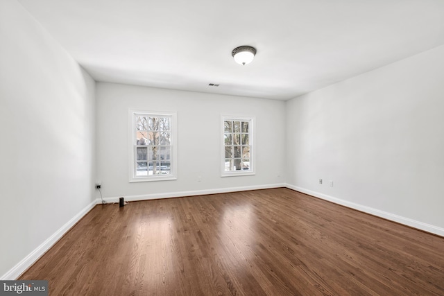 spare room featuring hardwood / wood-style floors