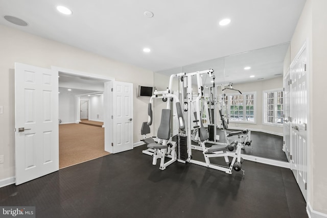 workout area with dark carpet