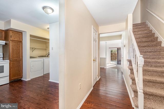 corridor with dark hardwood / wood-style floors and washer and clothes dryer