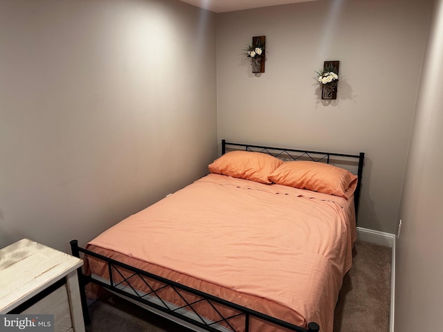 bedroom with dark carpet