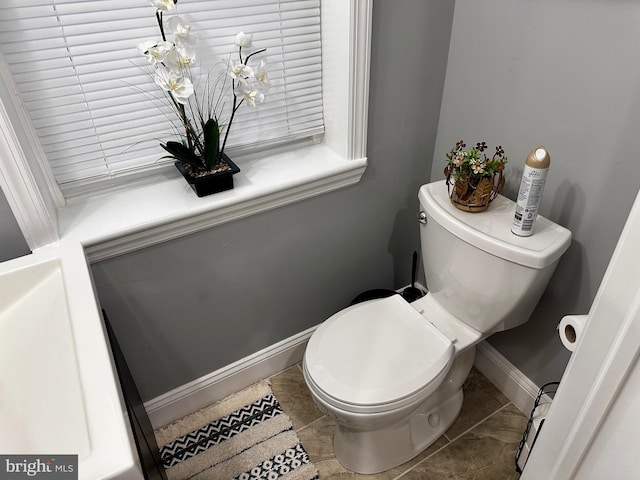 bathroom featuring tile patterned floors and toilet