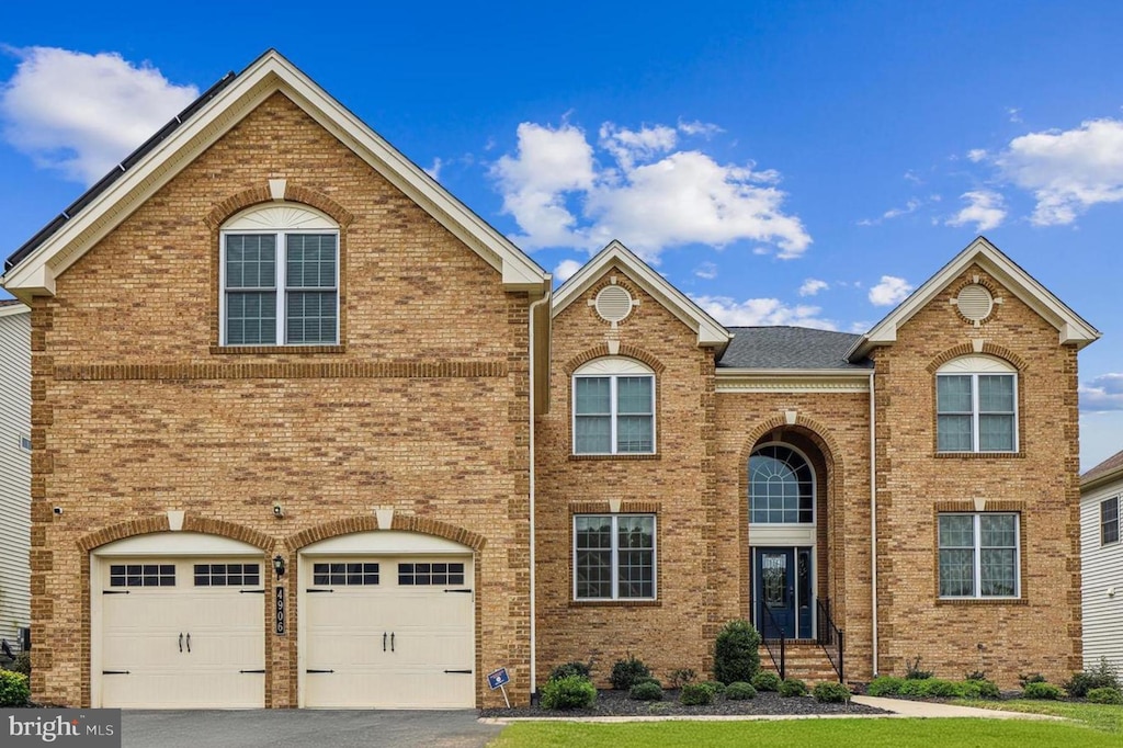 front of property with a garage