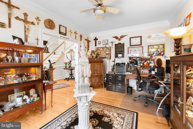 office area with wood-type flooring, ceiling fan, and crown molding