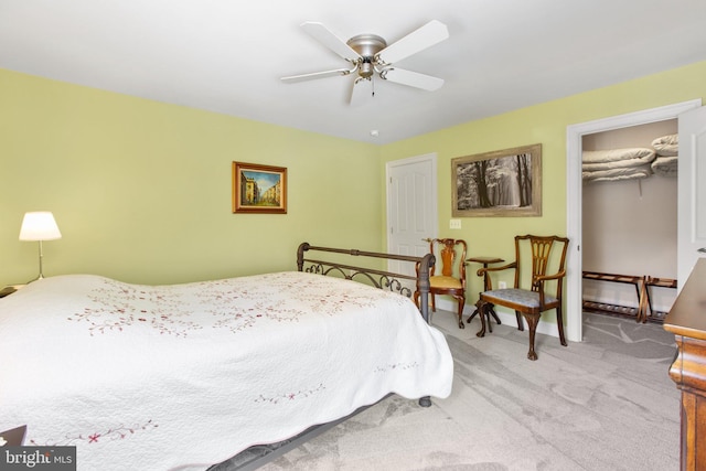 carpeted bedroom with a closet and ceiling fan