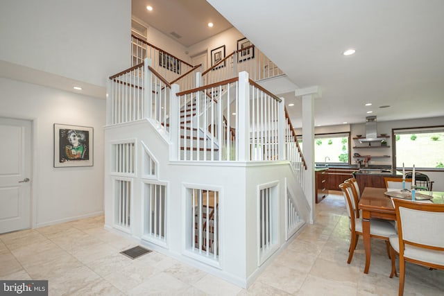 stairway with a high ceiling