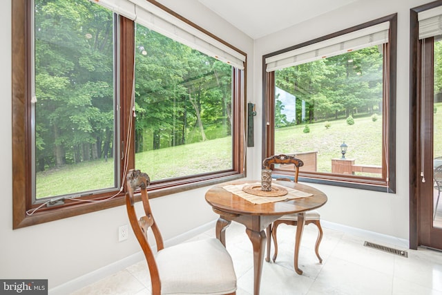 unfurnished sunroom with a wealth of natural light