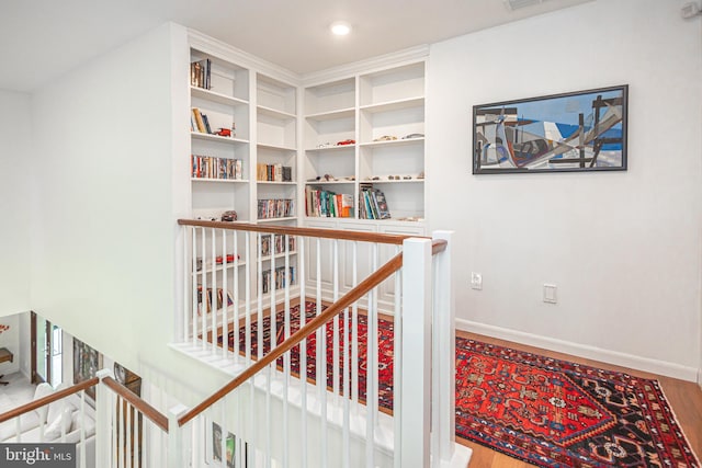 staircase featuring hardwood / wood-style floors