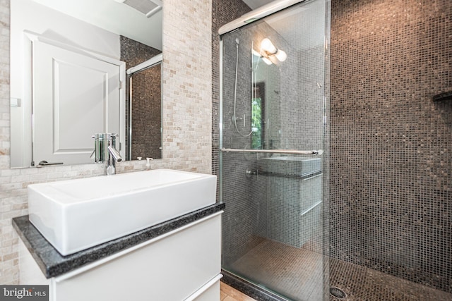 bathroom with vanity and walk in shower