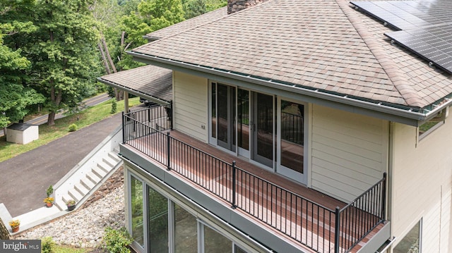 view of side of property with a balcony