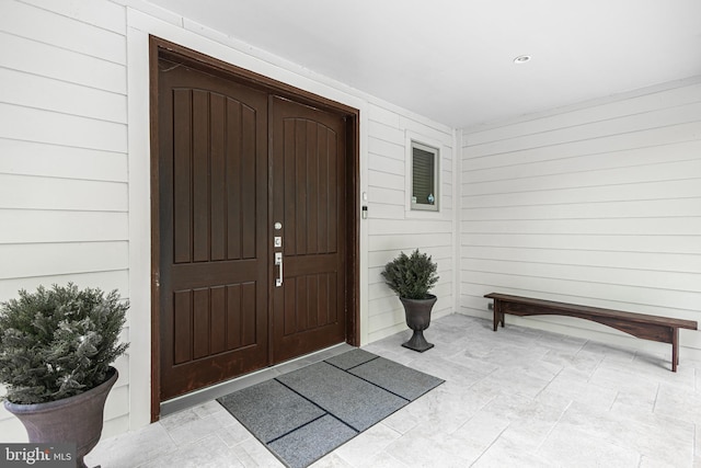 doorway to property featuring a porch