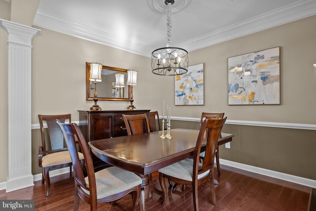 dining area featuring decorative columns, crown molding, and dark hardwood / wood-style floors