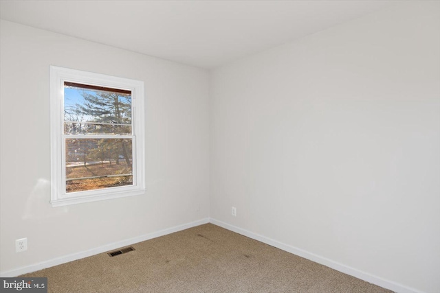 view of carpeted spare room