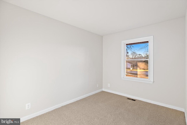 view of carpeted spare room