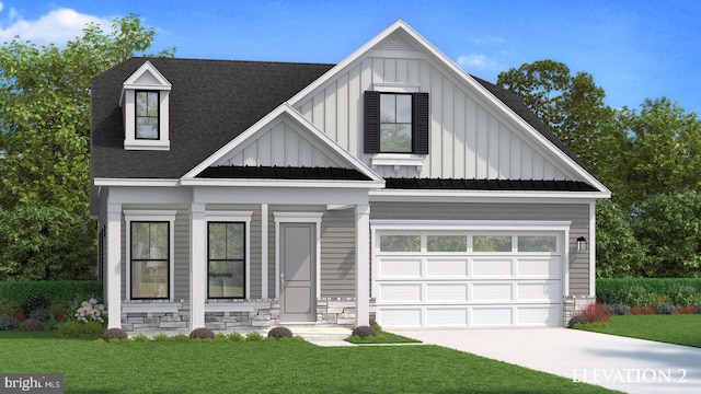 view of front of home with a front yard and a garage