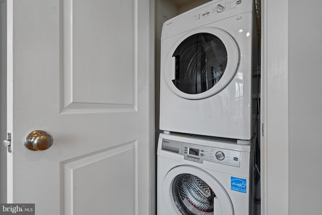 laundry room featuring stacked washer / dryer