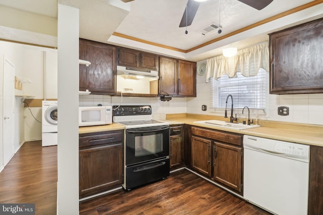 kitchen featuring white appliances, dark hardwood / wood-style floors, backsplash, and sink