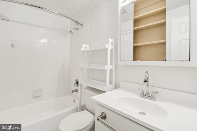 full bathroom with vanity, toilet, and tiled shower / bath