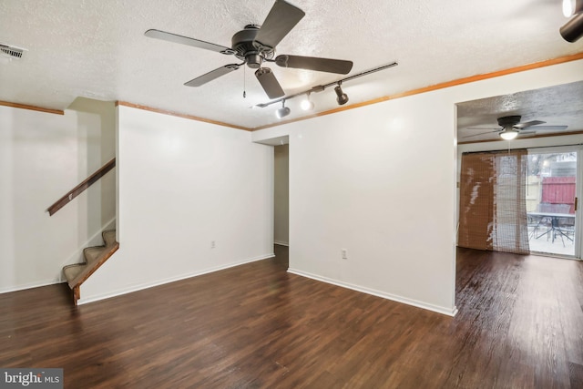 interior space with a textured ceiling and dark wood-type flooring