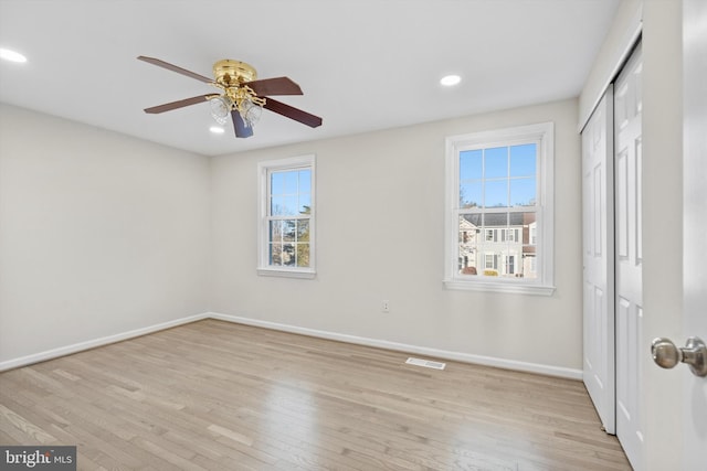 interior space with ceiling fan, plenty of natural light, and light hardwood / wood-style floors