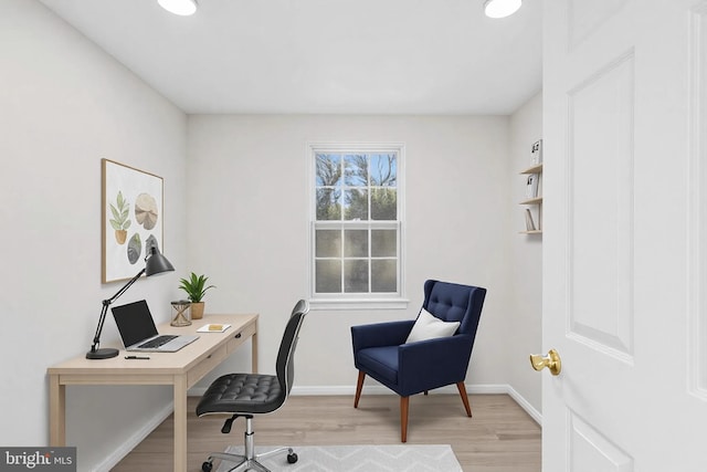 office space with light wood-type flooring