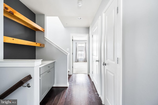 corridor featuring dark wood-type flooring