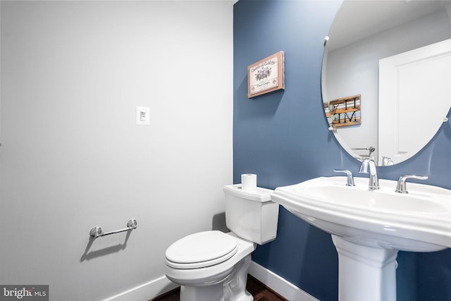 bathroom with sink and toilet