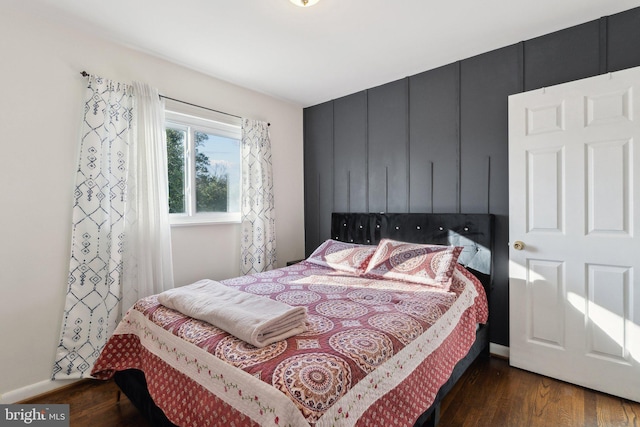 bedroom featuring dark wood-type flooring