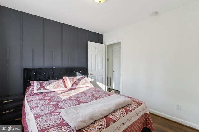 bedroom featuring dark wood-type flooring