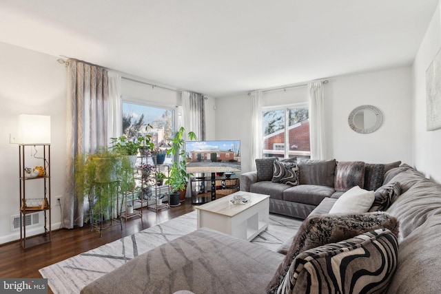 living room with dark hardwood / wood-style flooring