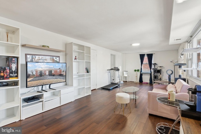 living room with dark hardwood / wood-style flooring