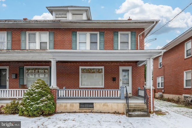 multi unit property featuring a porch