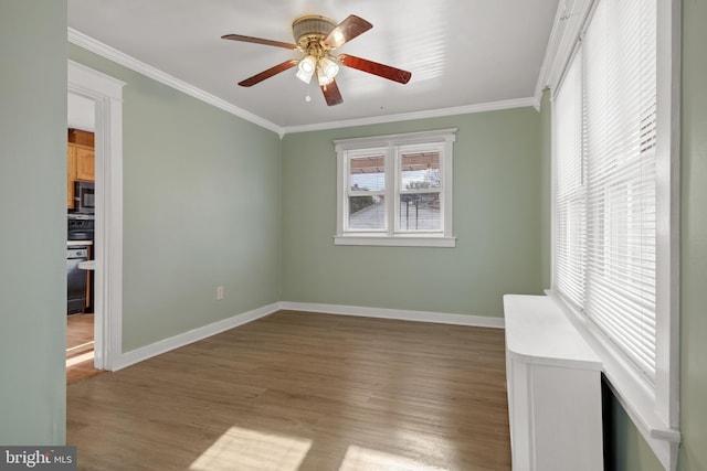 spare room with ceiling fan, light hardwood / wood-style floors, and ornamental molding