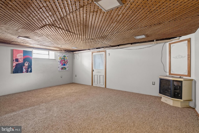 basement featuring carpet floors and wooden ceiling