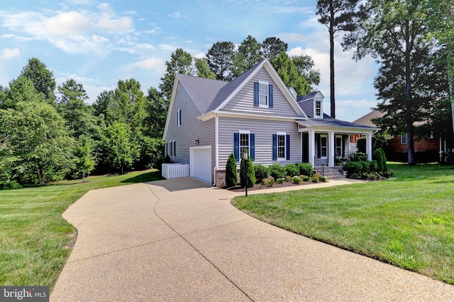 view of front of house with a porch, a front lawn, and a garage