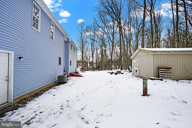 snowy yard with cooling unit