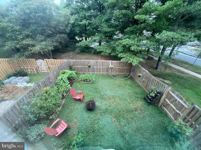 view of yard with a fire pit