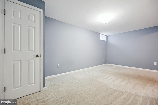 empty room featuring light carpet