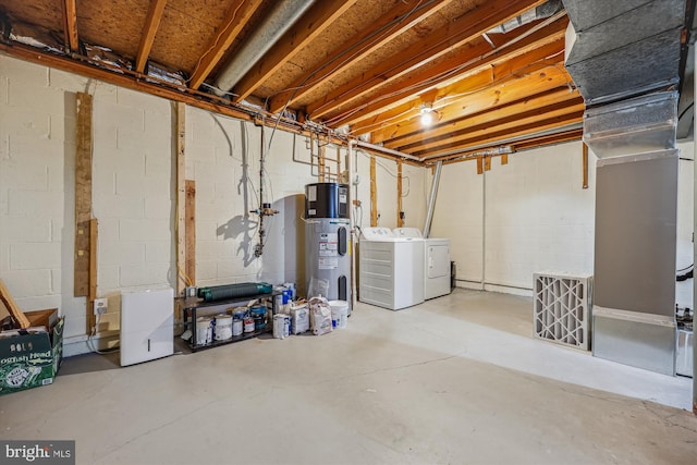 basement with hybrid water heater and washer and clothes dryer