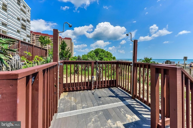 wooden terrace with a water view