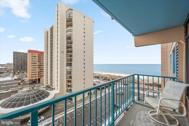 balcony with a beach view and a water view