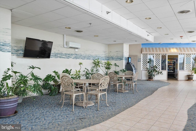 view of patio / terrace featuring a wall mounted air conditioner