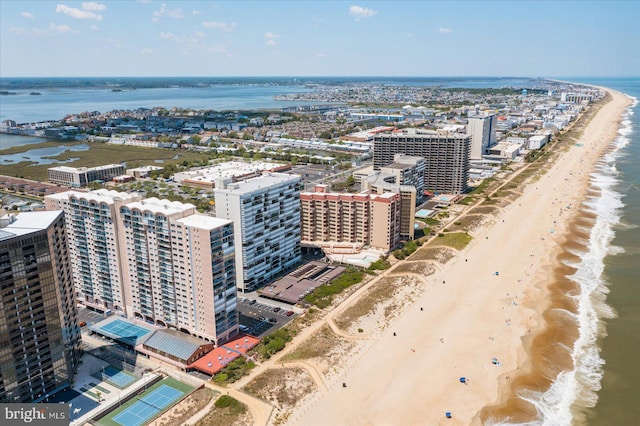 bird's eye view featuring a water view and a view of the beach