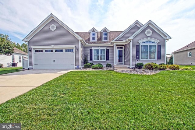 view of front of home featuring a garage, central AC unit, and a front lawn