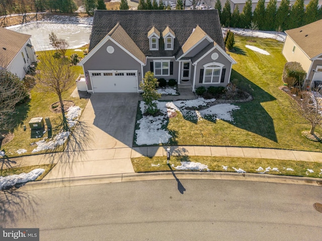 view of front facade featuring a garage and a front lawn