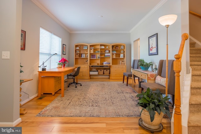 office featuring ornamental molding and light hardwood / wood-style floors