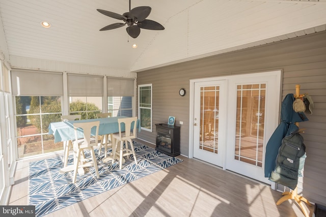 sunroom featuring ceiling fan and vaulted ceiling